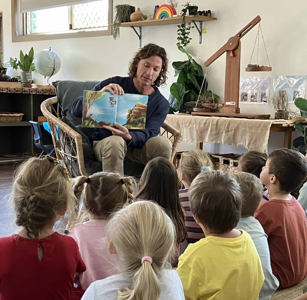 Joshua Appleby reading Bazza Has a Stack at a daycare for bike safety and road safety week.