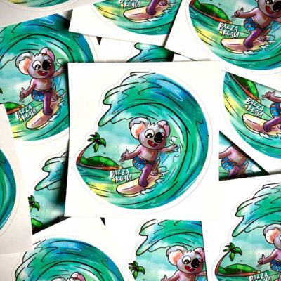 75mm matte Bazza Gets Barrelled surfing koala sticker showcasing Bazza Koala riding a wave.